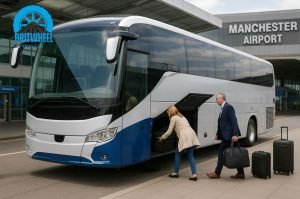 Executive coach at Manchester Airport terminal with passengers loading luggage—efficient group transfer.
