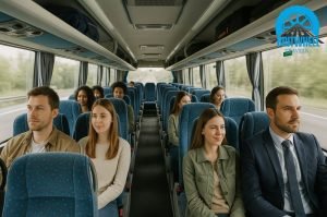 Interior of a standard coach in the UK showing passengers seated with comfort and luggage storage.