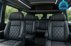 Interior view of 12-seater minibus showing padded seats, USB ports, LED lighting, and luggage space