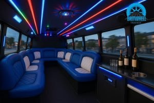 Interior of a moving UK party bus with lounge seating, ambient lighting, and onboard sound system for group fun.
