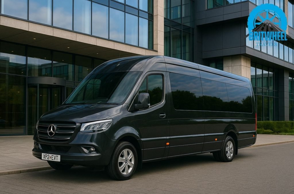 Luxury chauffeur-driven executive minibus outside modern UK hotel